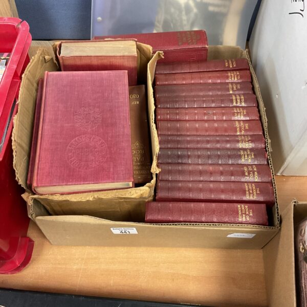 Stack of vintage books including homeowner guides and encyclopaedias.