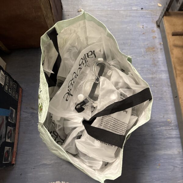 Bag of new 'laif' brand safety goggles for industrial use.