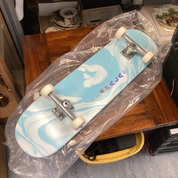 Sealed Impala skateboard deck with unique marbled design.
