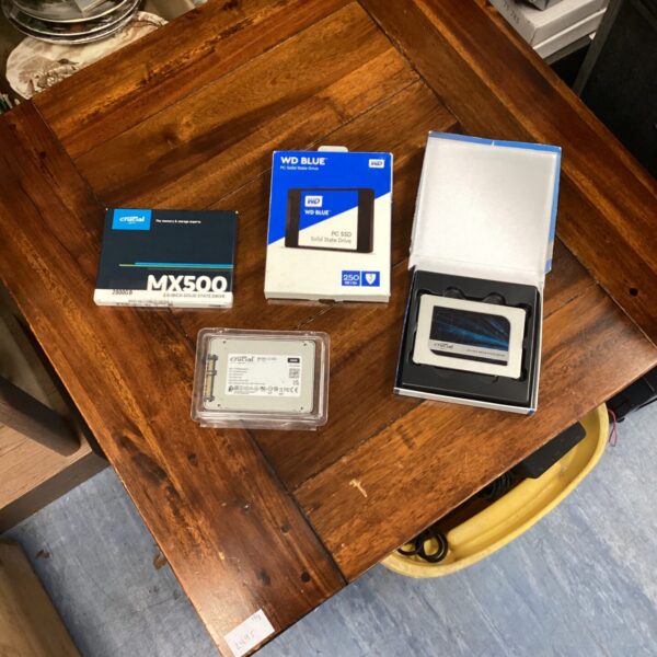 Lot of four SSD hard drives including Crucial MX500.