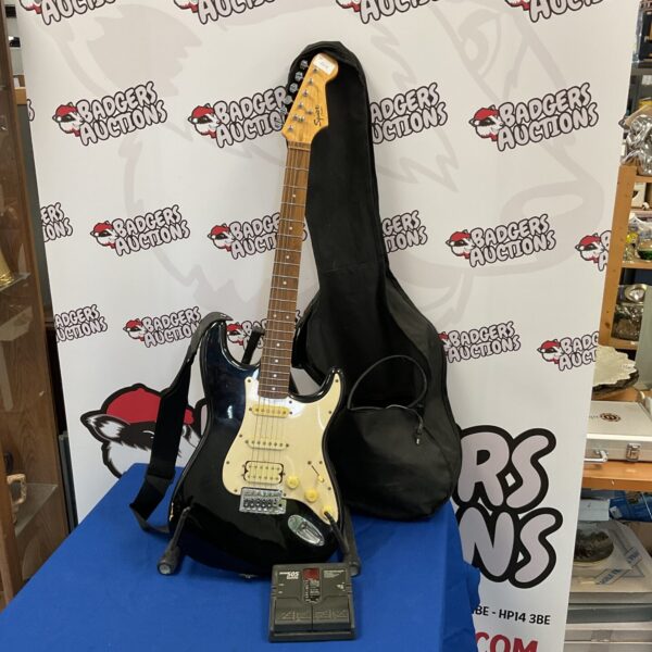 Fender Squire Strat electric guitar with Zoom 505 pedal and case.