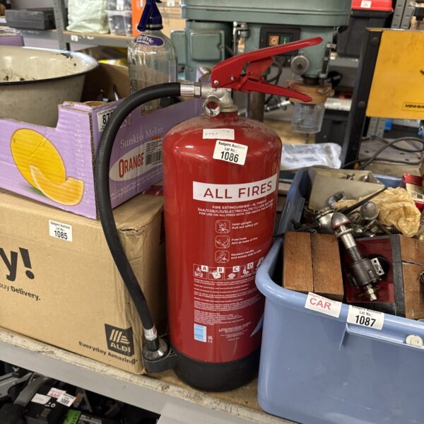 Red vintage fire extinguisher, Lot 1086, Badger Auctions.