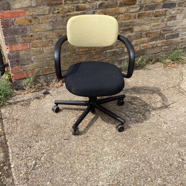 Black Vitra office chair with ergonomic design and swivel function.
