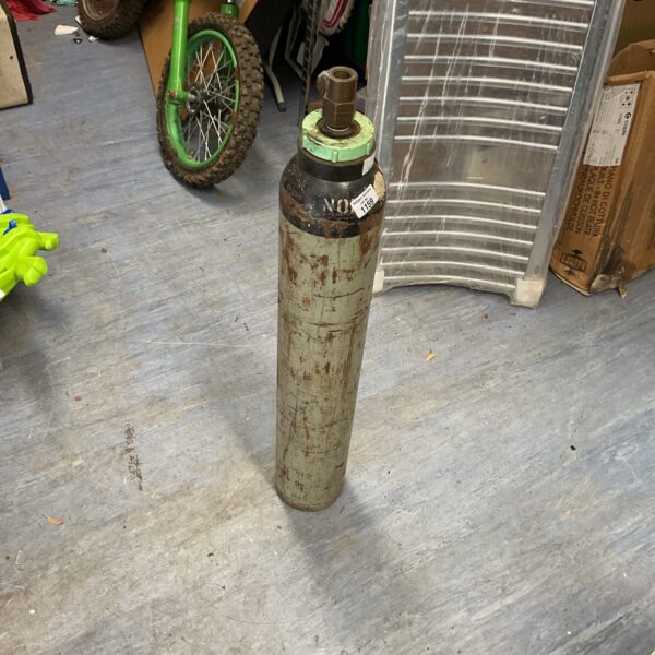 Used nitrogen gas bottle showing signs of wear.