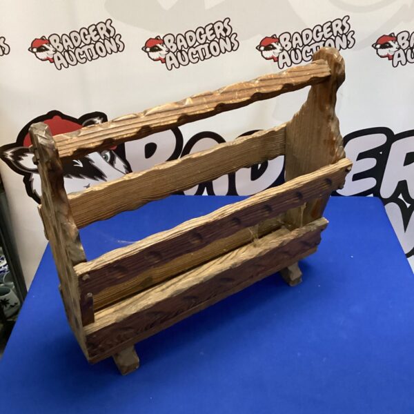 Vintage wooden magazine rack for rustic home decor.