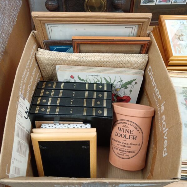 Mixed lot featuring terracotta wine cooler, picture frames, and place mats.