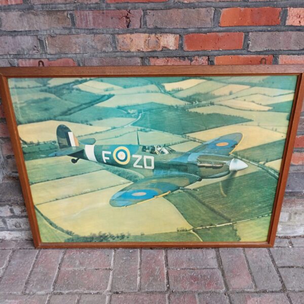 Framed Spitfire print, vintage WWII aviation art for collectors.