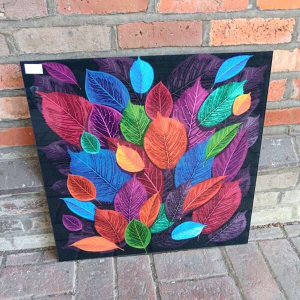 Vibrant colourful leaf print on glass panel for modern home decor.