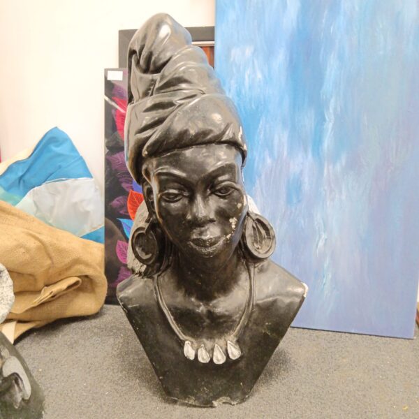 Dark Zimbabwe Shona sculpture bust of a lady, detailed stone carving.