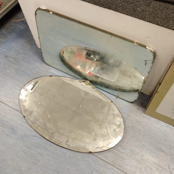 Pair of vintage bevel edge mirrors with silvered glass.