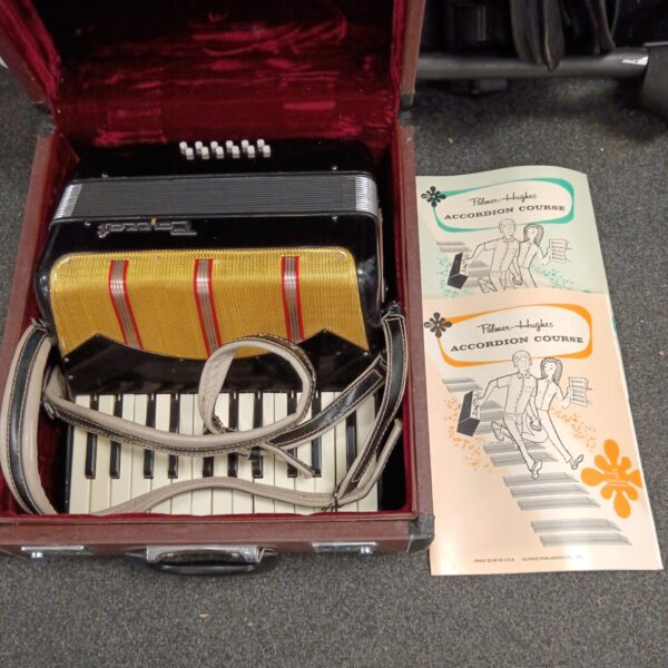 Vintage Parrott accordion in red case with instructional books.