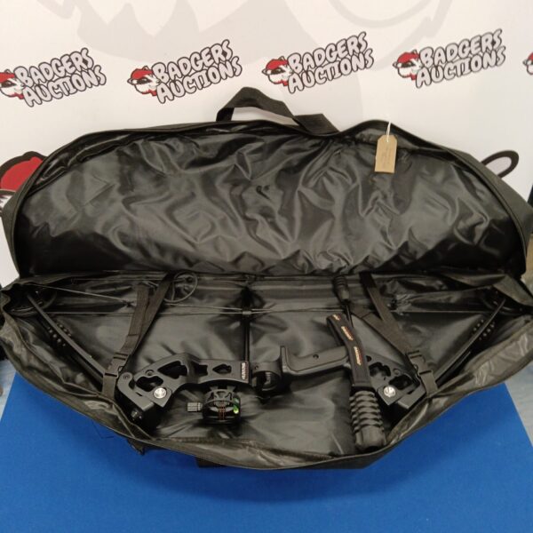 Junxing compound bow in a black carrying case.