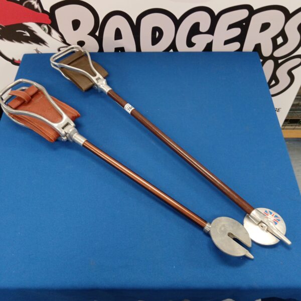 Vintage shooting sticks with leather seats for game shooting.
