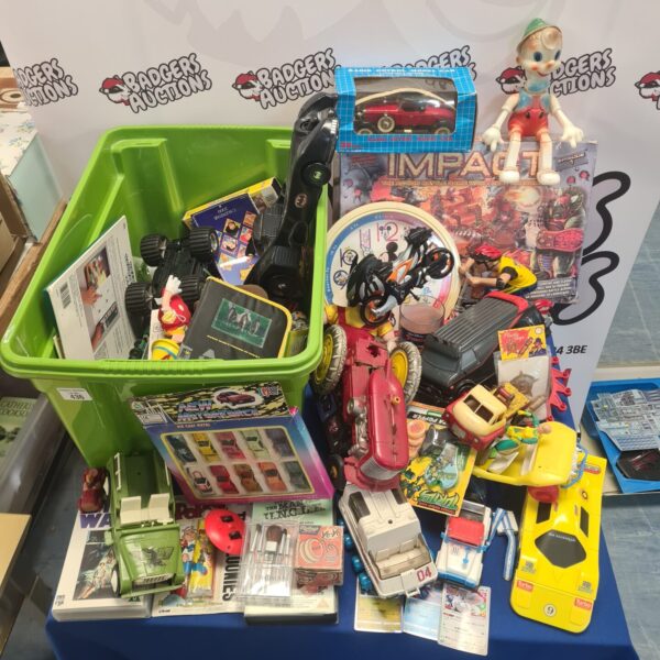 Overview of a vintage toy lot with various 80s and 90s toys.