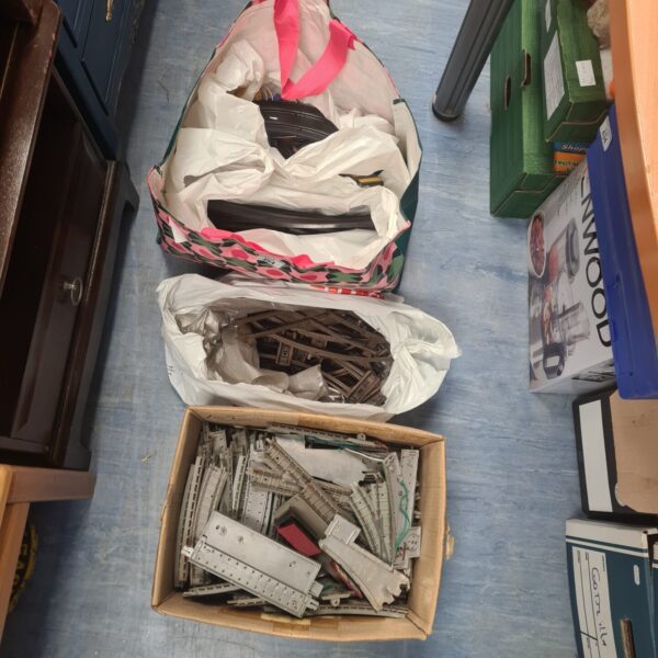 Mixed lot of vintage Scalextric and Hornby track pieces for racing and railways.
