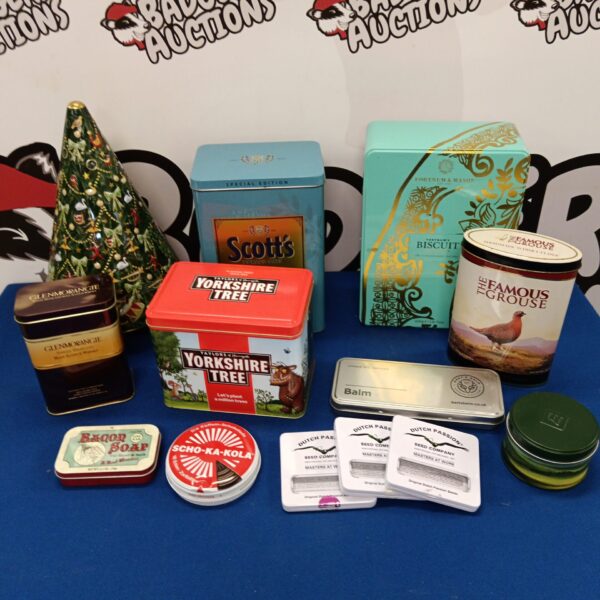 Group of vintage collectible tins, including Famous Grouse and Glenmorangie.