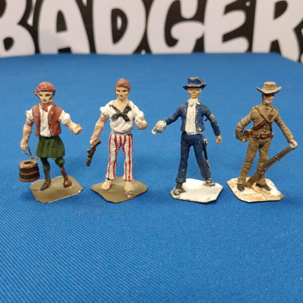 Vintage lead figures lot including pirate and cowboys.