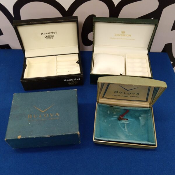 Vintage watch boxes lot including Bulova, Accurist and Sovereign brands.