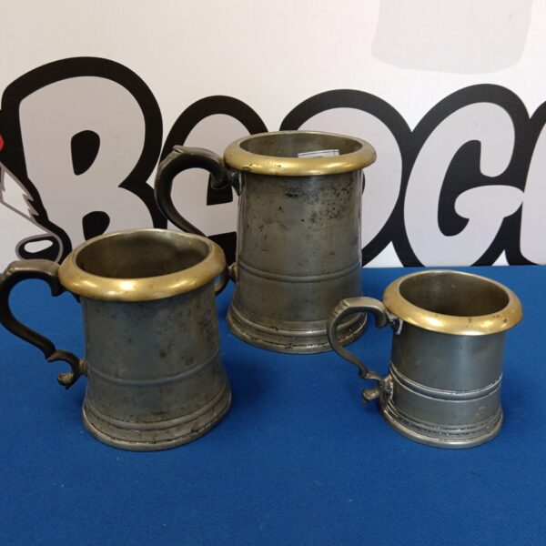 Set of three antique Gaskell & Chambers pewter measures.