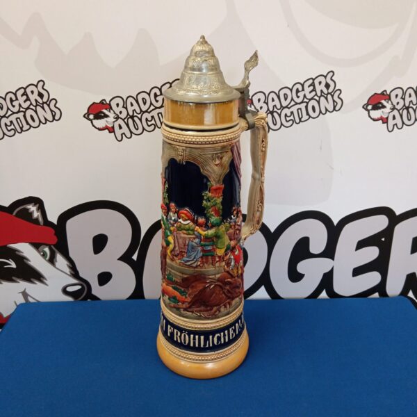 Large lidded West German stein with detailed scene.