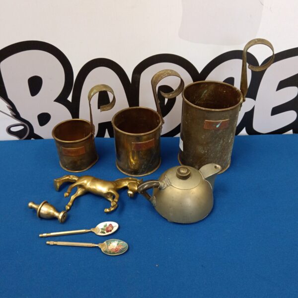 Vintage brass collection featuring measures, teapot and horse figurine.