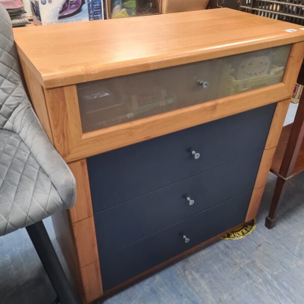 Wooden Ikea office drawers providing storage in a home office setting.