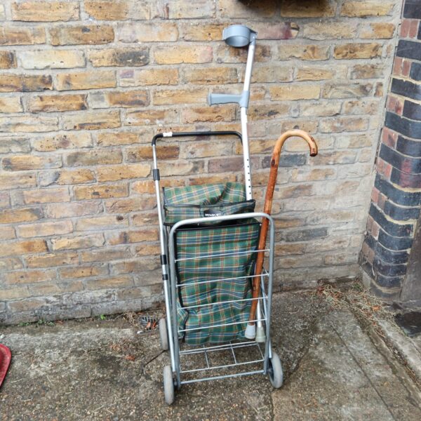Vintage Newbury shopping trolley with plaid liner and walking sticks.
