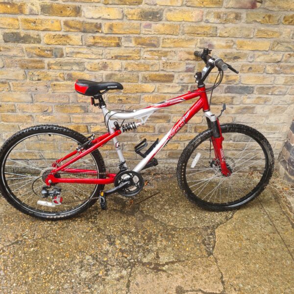 Red and silver Apollo FS26 mountain bike with full suspension.