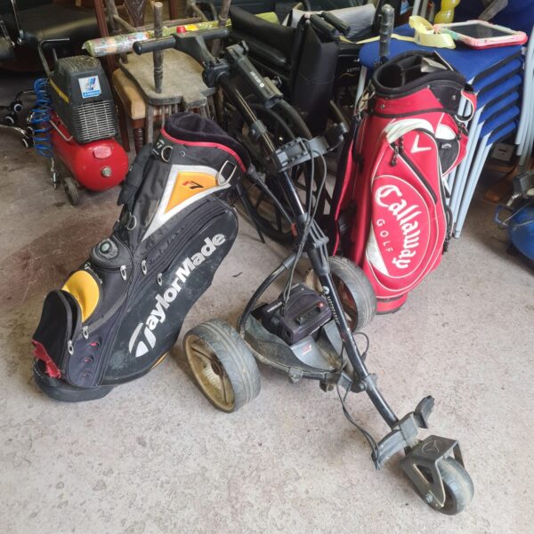 Golf bag bundle including Taylormade and Callaway bags with trolley.
