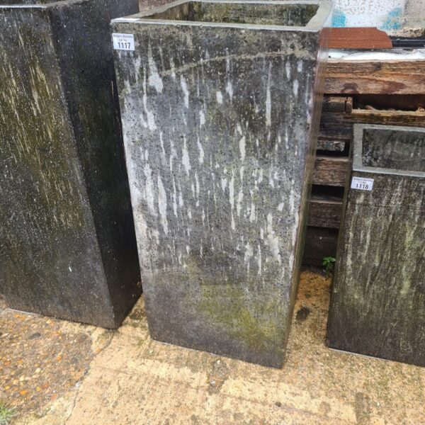 Large granite stone planter for garden display.