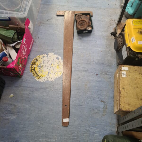 Vintage draughtsman T square with Avery weights for measuring.