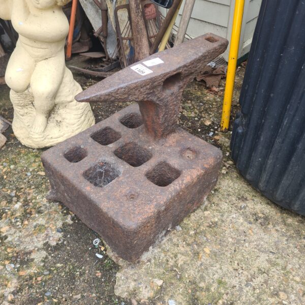 Antique blacksmith anvil with a weathered surface and hardy hole.