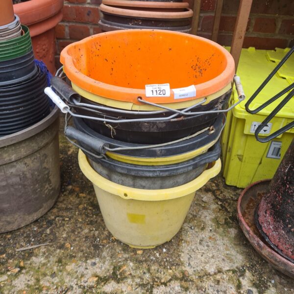 Stack of used plastic builders buckets for garden and DIY.