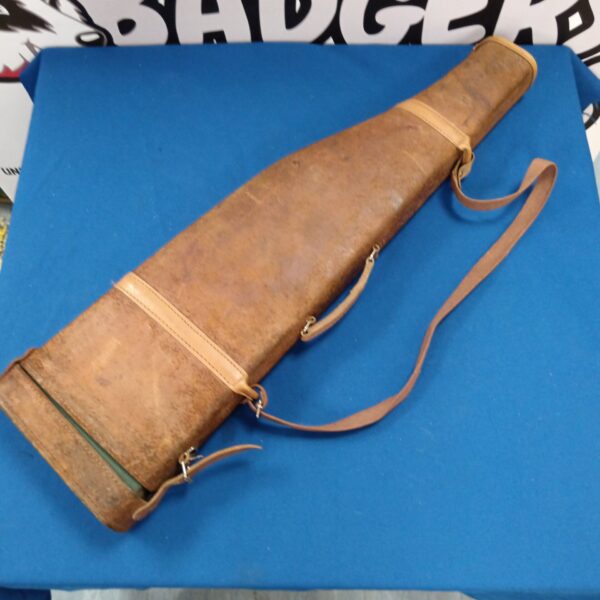 Vintage leather leg of mutton rifle case with carrying strap.