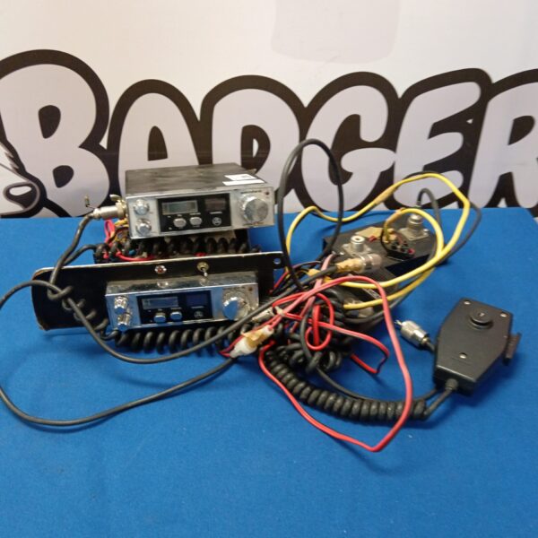 Vintage Uniden CB radio pair with microphone and wiring.