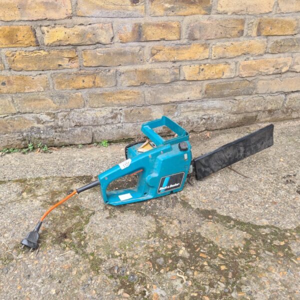 Black and Decker electric chainsaw for garden and DIY tasks.