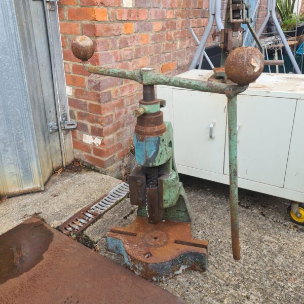 Vintage Norton 4S fly press for metalworking, showing signs of age.