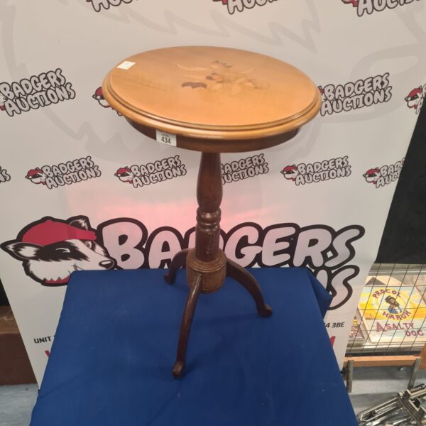 Vintage mid-century lamp table with floral pattern.