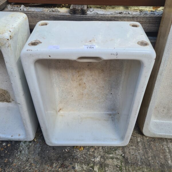 Vintage ceramic Belfast sink with a classic farmhouse style.