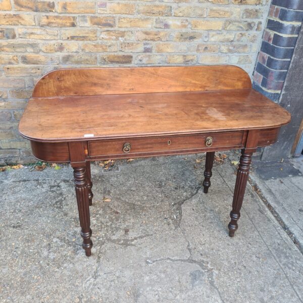 Antique mahogany console table with a single drawer and tapered legs.