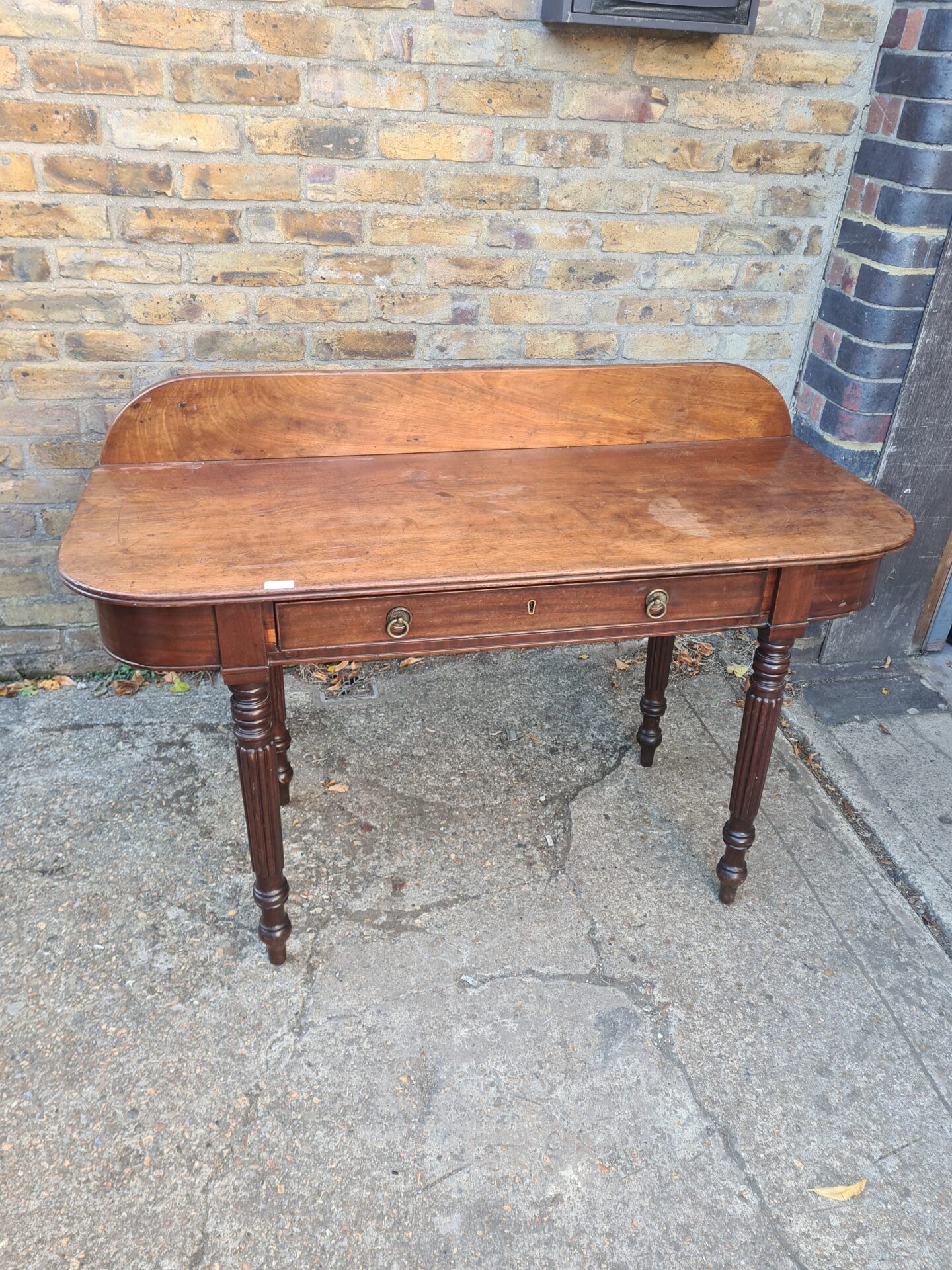 1187 Antique mahogany console table with draws