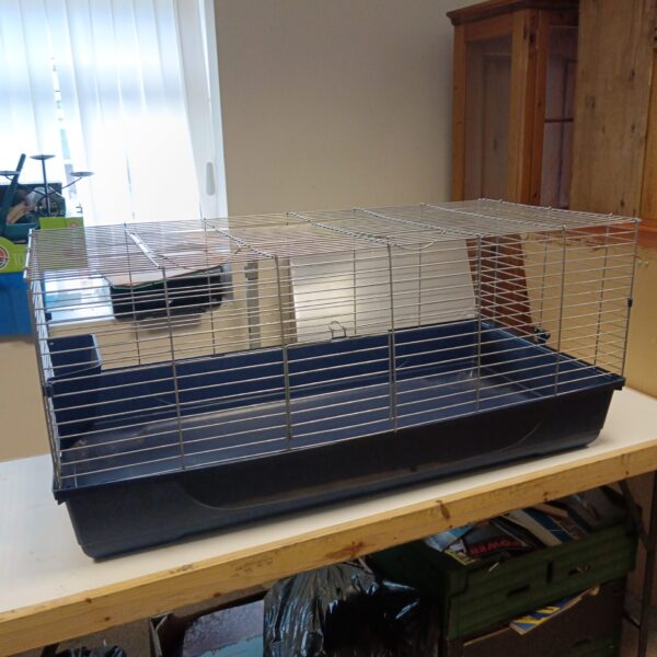 Large guinea pig cage with wire frame and plastic base.