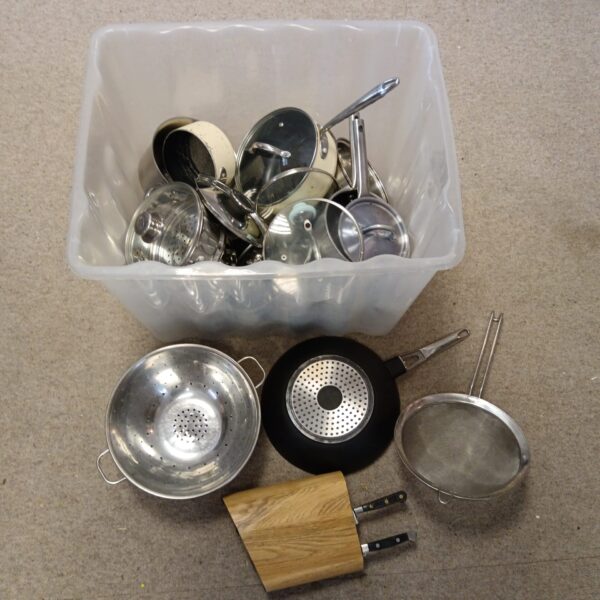Large lot of stainless steel cookware including pots and pans.