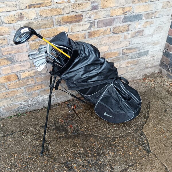 Black Nike golf club set in a carry bag, showing signs of use.