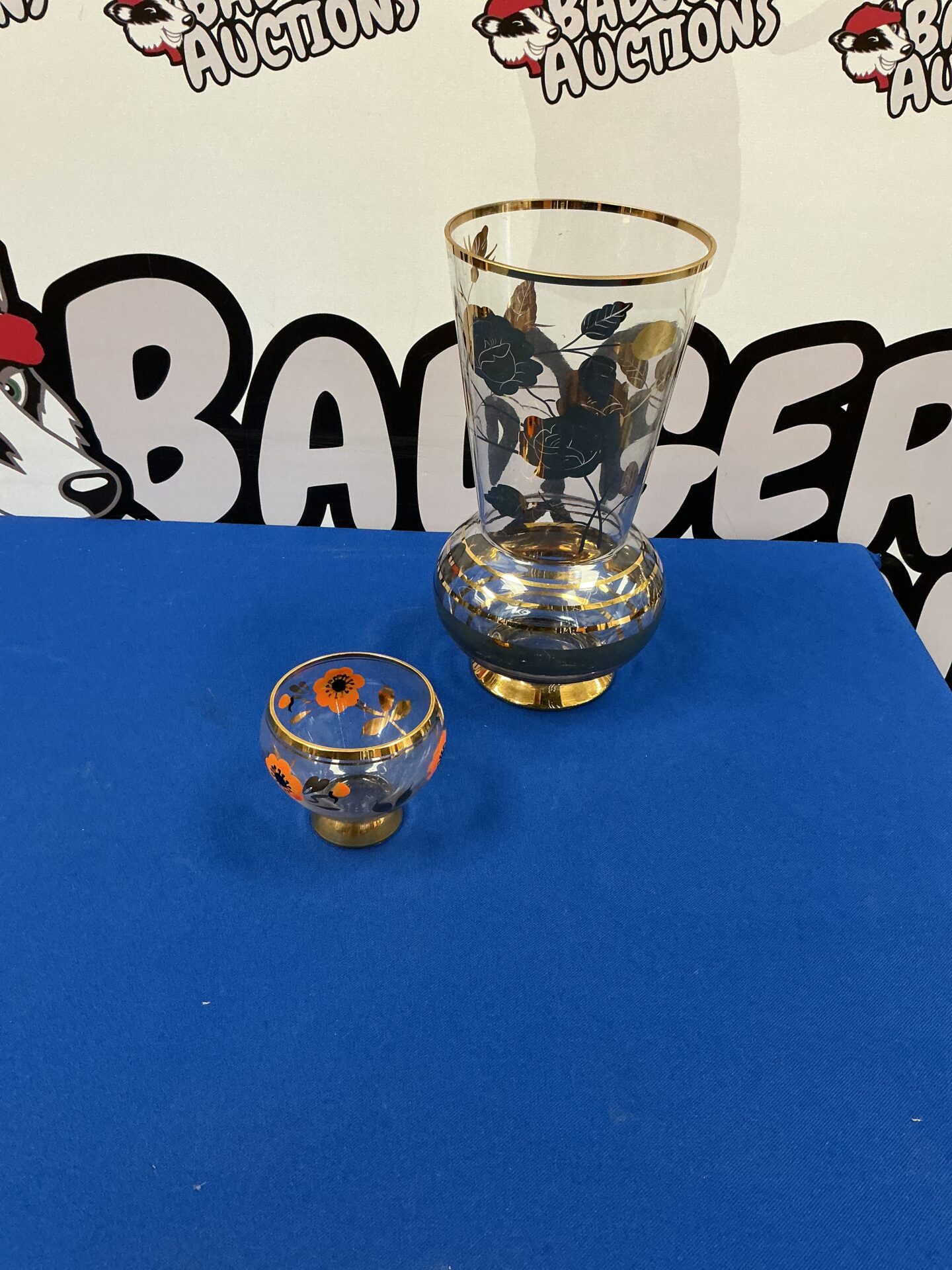 345 Two decorative glass vases with gold leaf rims & rose design