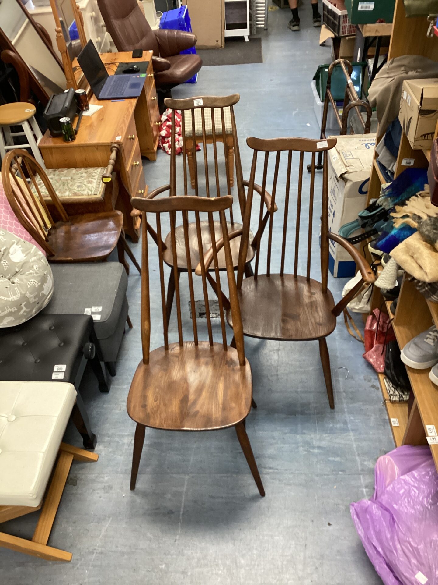 1253 Two Ercol stick back carver chairs & one Ercol stick back dining chair