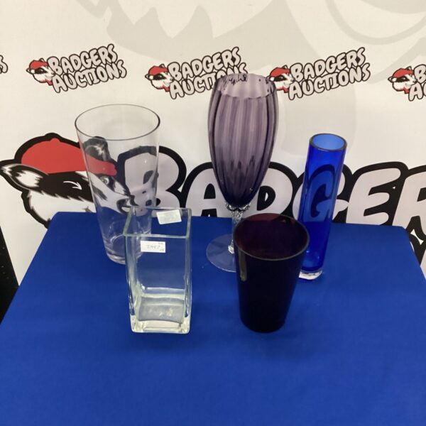 Selection of colourful glass vases for home decor.