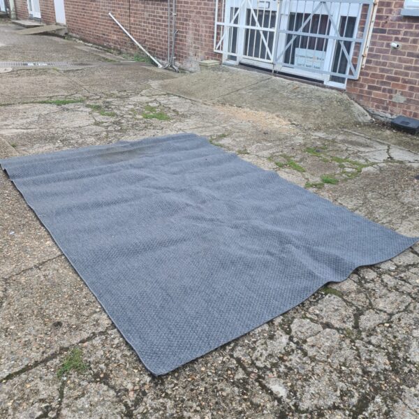 Large grey Ikea Morum rug displayed indoors.