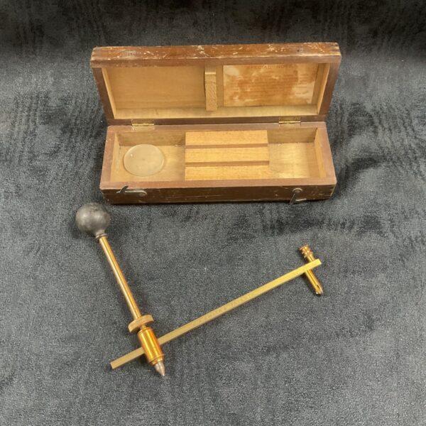 Vintage brass glass hole cutter in wooden case.
