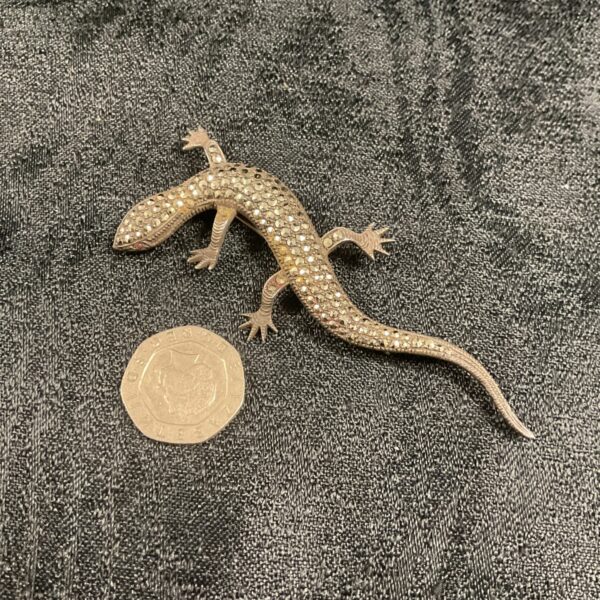 Vintage silver marcasite lizard brooch, detailed close-up.